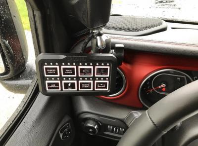 Interior view of a jeep featuring a remote control on the dashboard, showcasing a blend of adventure and technology.